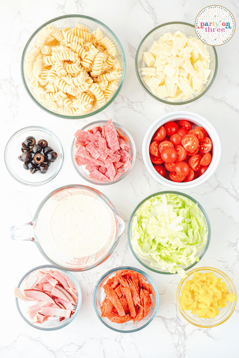 Ingredients needed to make grinder pasta salad.