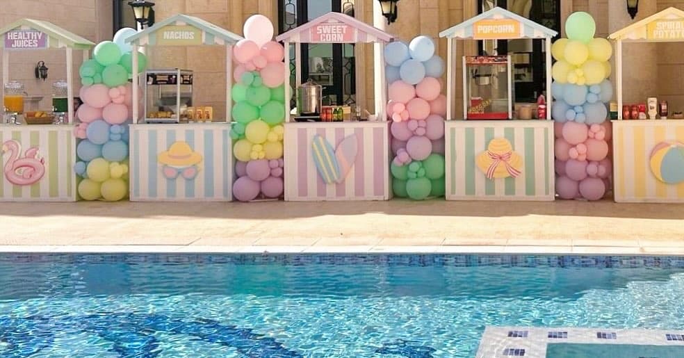 Pastel Food Stand Booths with Balloon Columns Setup