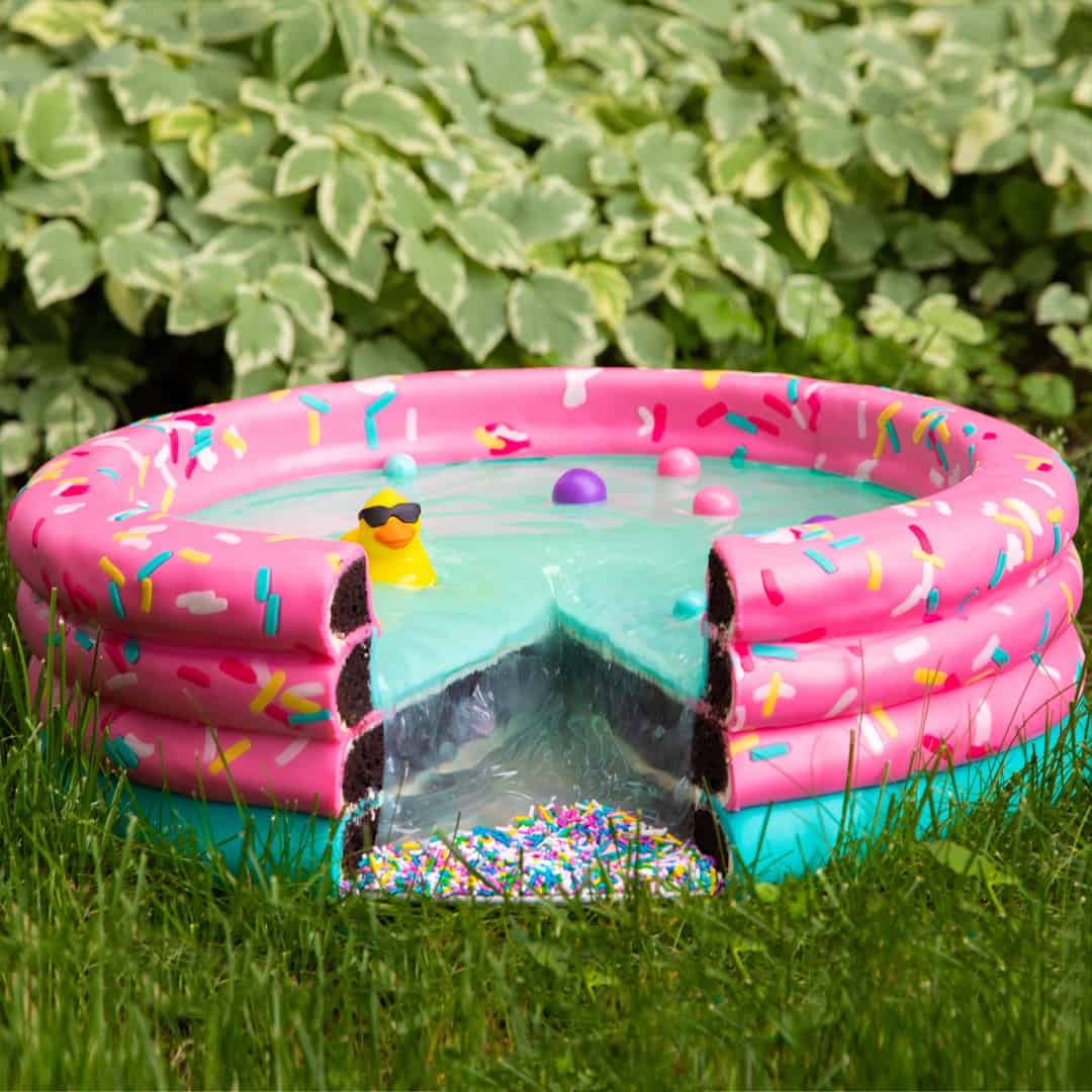 Inflatable Pool Cake with Chocolate Layers and Blue Frosting