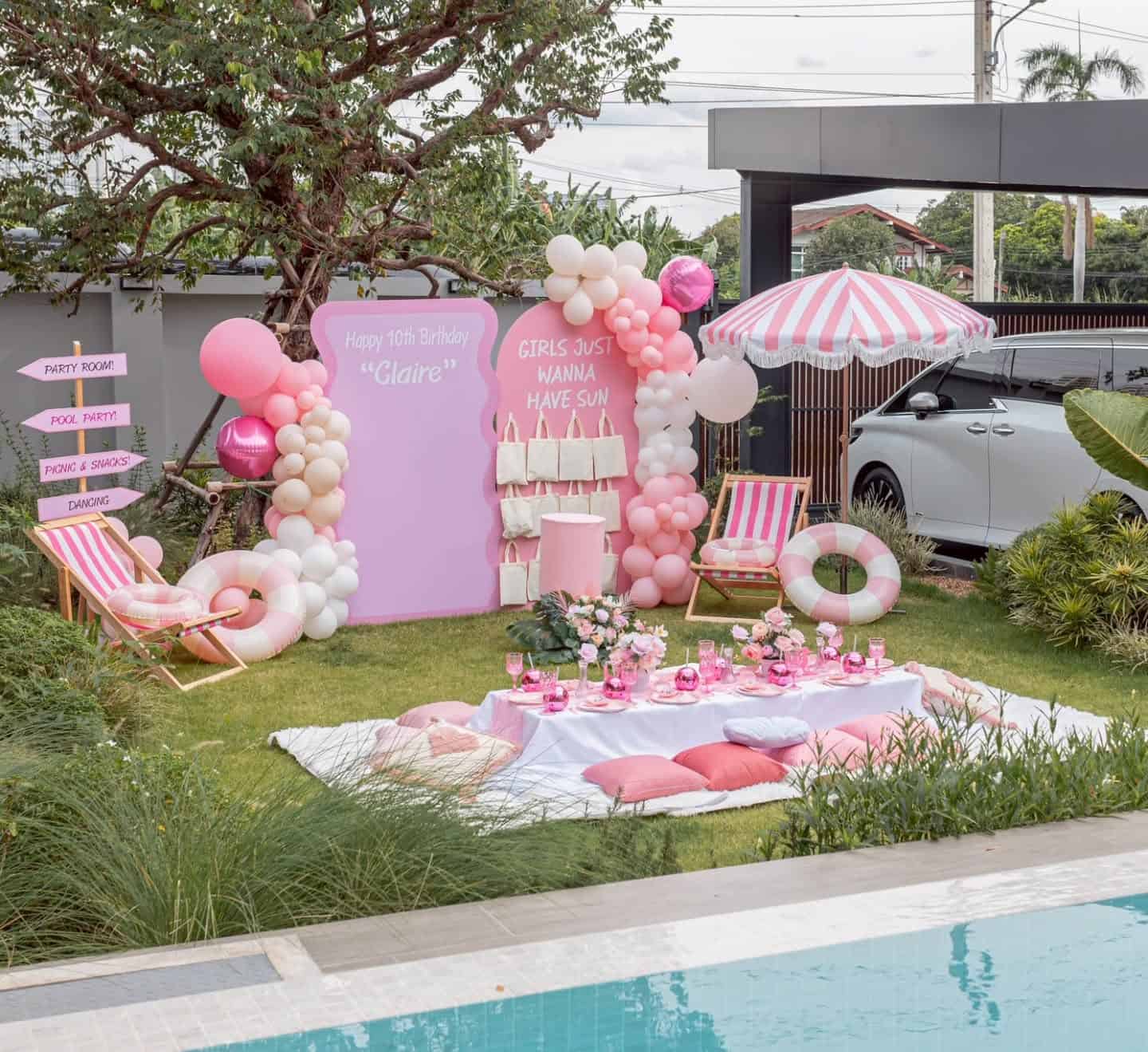Pink Barbie Pool Party Setup with Balloon Backdrop