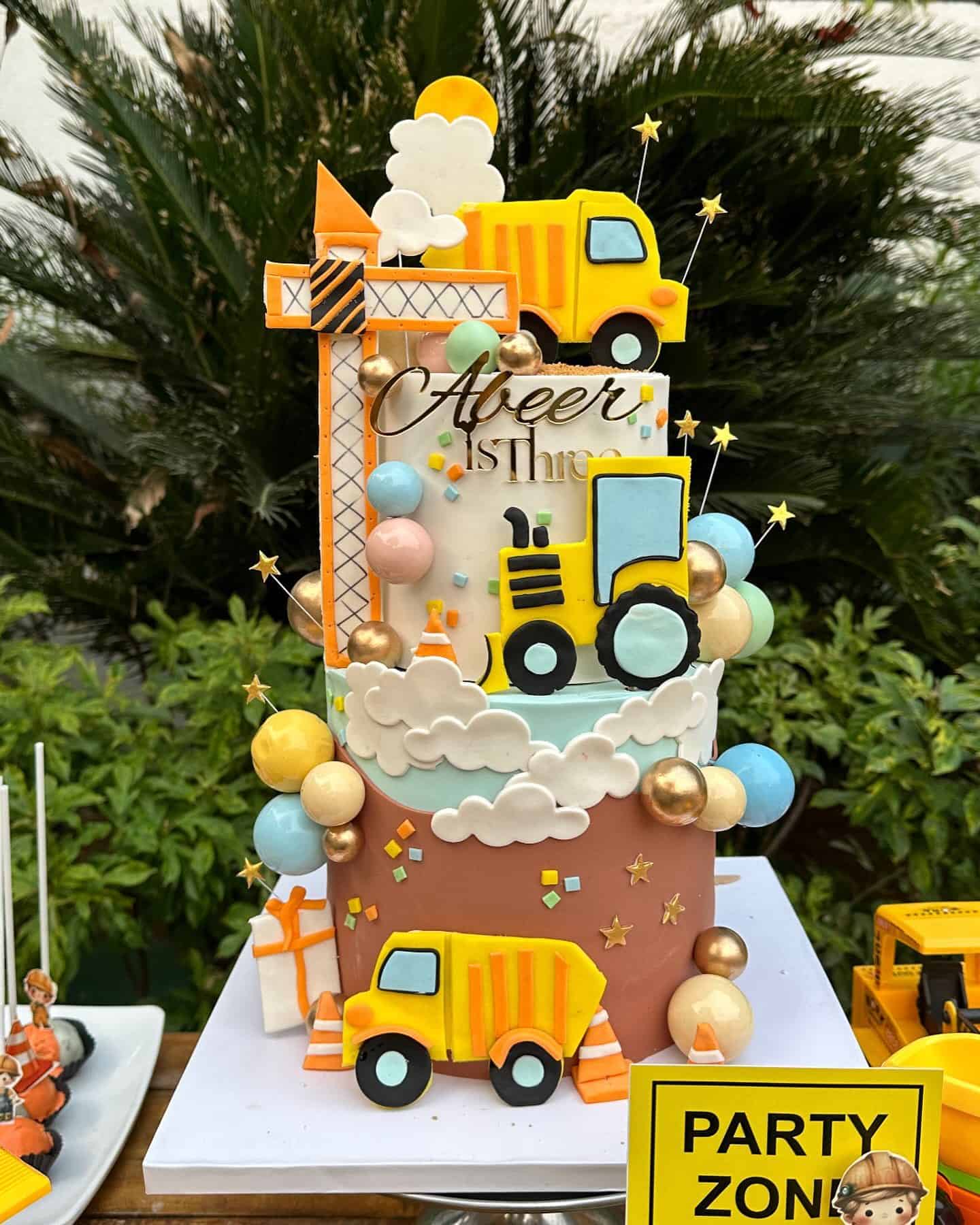 Construction Truck Themed Two-Tier Birthday Cake with Fondant Vehicles