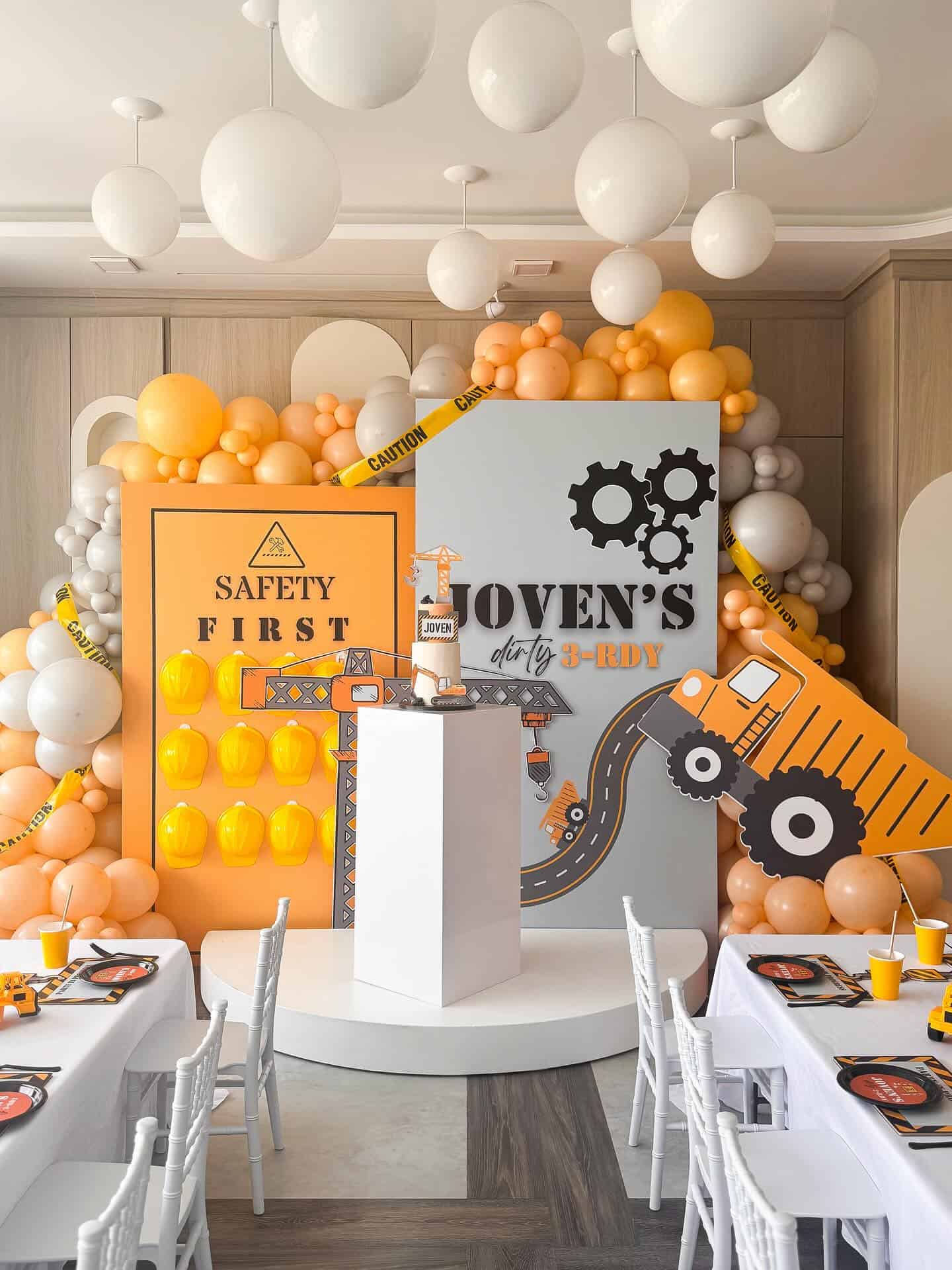 Construction Site Birthday Party Setup with Safety First Backdrop