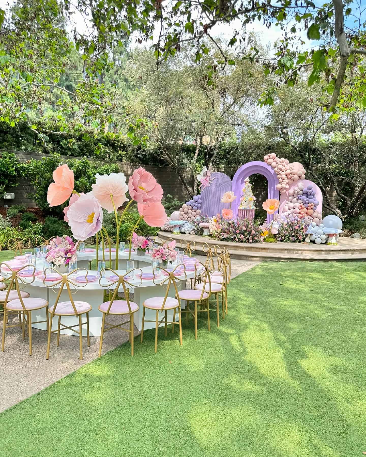 Butterfly Garden Party Setup with Oversized Paper Flowers