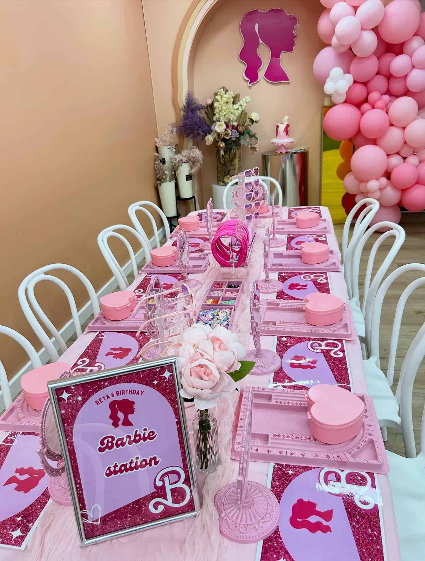 Barbie Themed Birthday Party Table with Pink Balloon Garland
