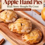 Wooden tray of glazed apple hand pies labeled easy with store-bought pie crust