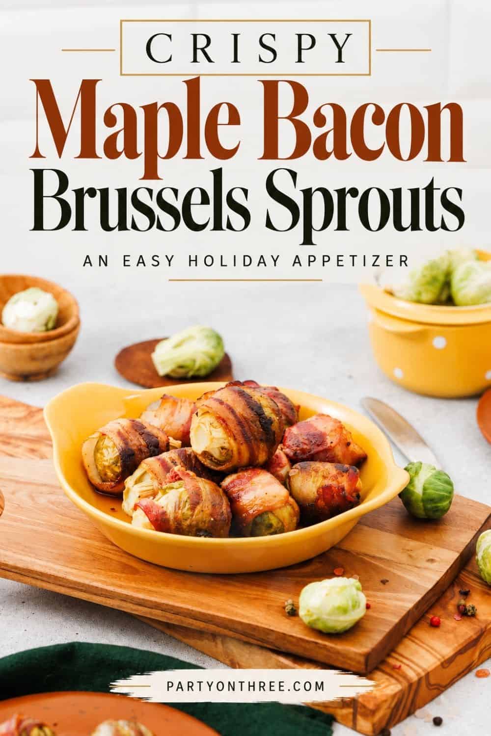 Roasted Maple Bacon Wrapped Brussels Sprouts piled in a yellow dish on a wooden board