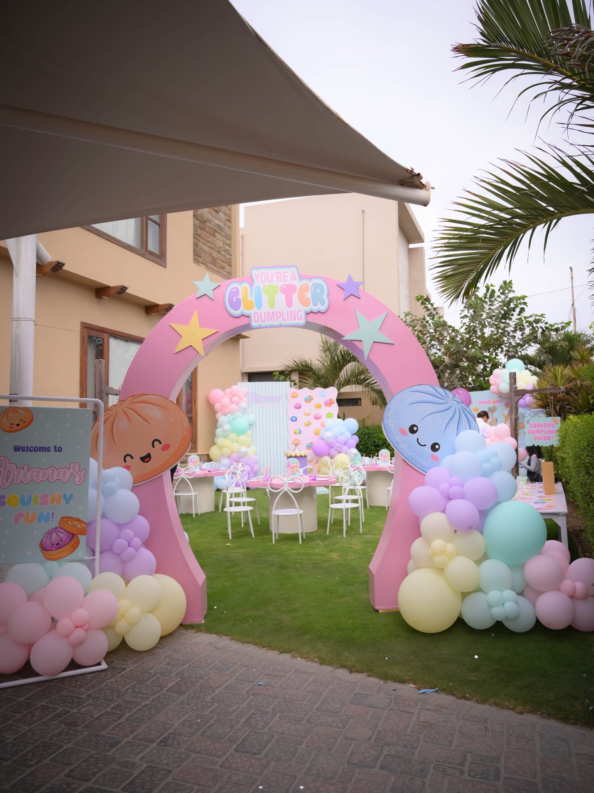 Pastel Balloon Arch Entrance With Squishy Character Cutouts