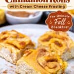 Spoon drizzling cream cheese glaze over baked pumpkin cinnamon rolls in a pan
