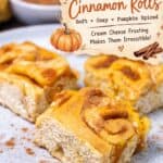 Close up of pumpkin cinnamon rolls with cream cheese frosting text banner