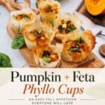 Pumpkin Feta Phyllo Cups arranged on olive wood board above recipe title banner