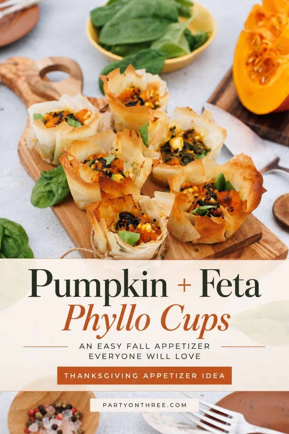 Pumpkin Feta Phyllo Cups arranged on olive wood board above recipe title banner