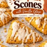 Pumpkin scones with vanilla glaze styled with mini pumpkins and cinnamon sticks nearby