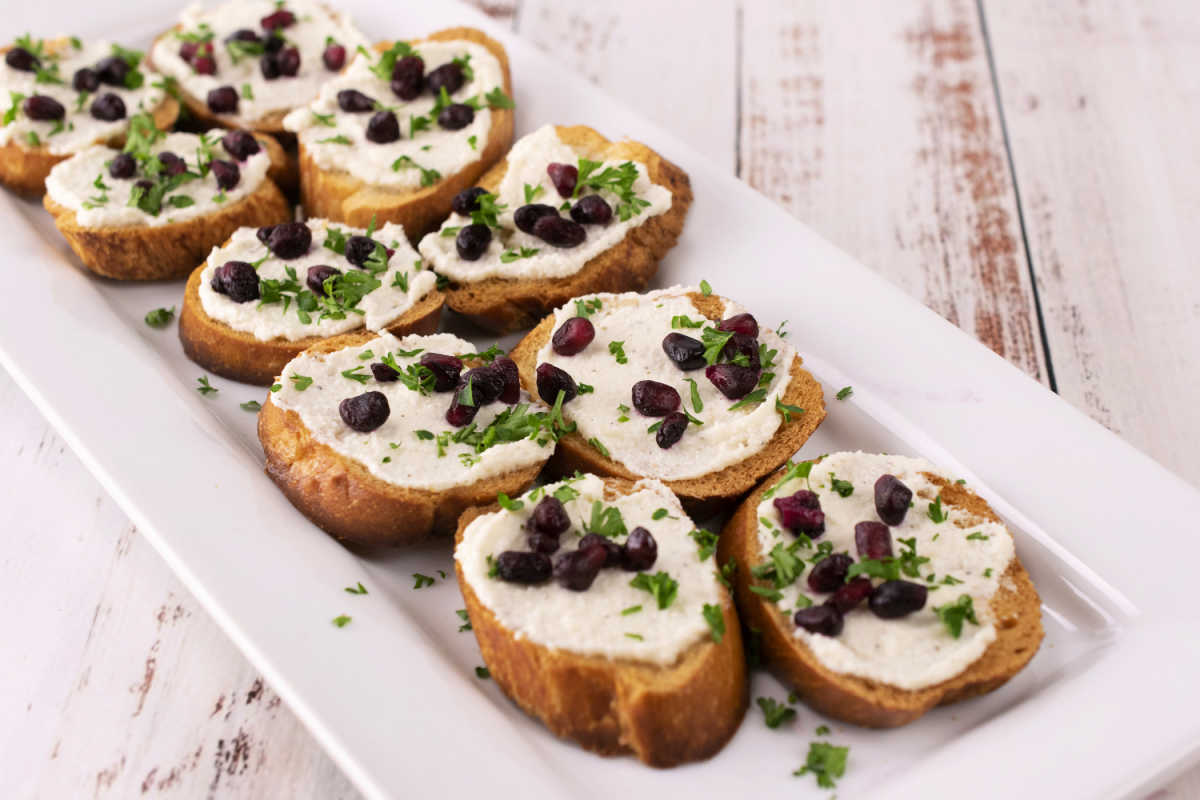 Roasted Garlic Whipped Feta Crostini with Pomegranate