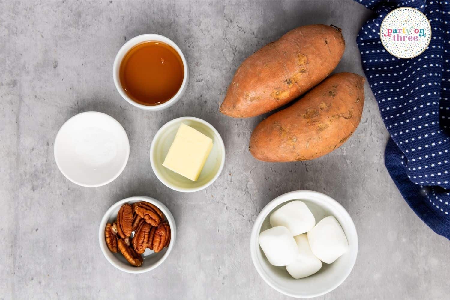 Raw ingredients for Sweet Potato Bites including sweet potatoes, marshmallows, pecans, butter, sugar, and honey