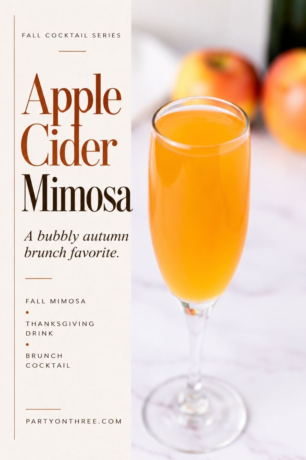 Apple Cider Mimosa in a champagne flute with apples blurred in the background