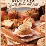 Apple cinnamon muffins with crumb topping on a wooden board, surrounded by apple slices and cinnamon sticks