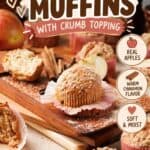 Apple cinnamon muffins with crumb topping on a wooden board, surrounded by fresh apples and cinnamon sticks.