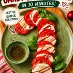 Caprese Candy Cane appetizer with tomato and mozzarella slices, basil, and balsamic drizzle on a green plate