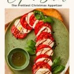 Caprese Candy Cane appetizer on a green plate, tomato and mozzarella slices with balsamic glaze and basil
