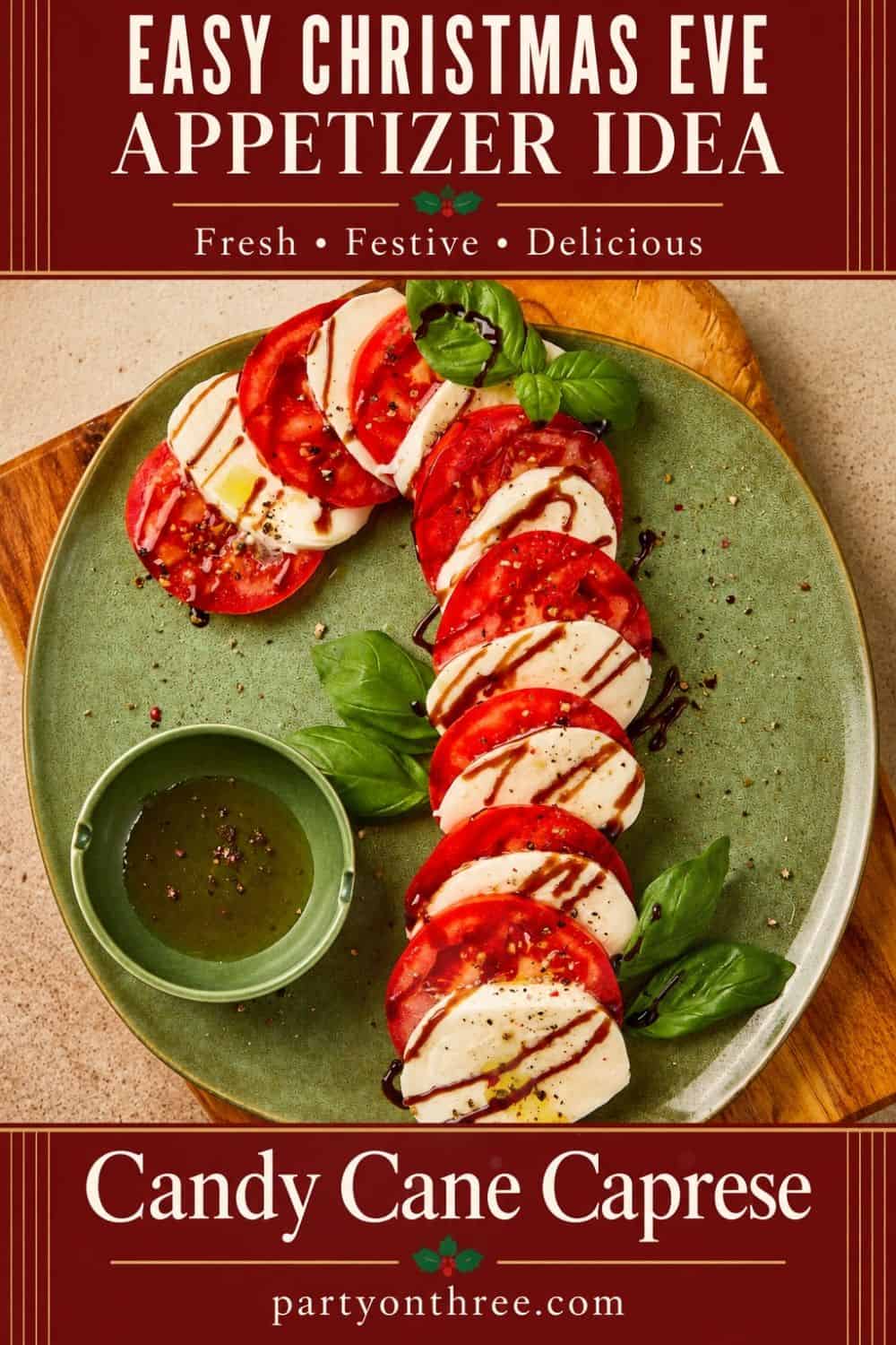 Caprese Candy Cane appetizer on a green plate with balsamic glaze, basil, and dipping sauce.