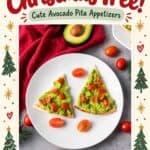 Triangle pita slices topped with mashed avocado and diced tomatoes, styled as Christmas tree appetizers.