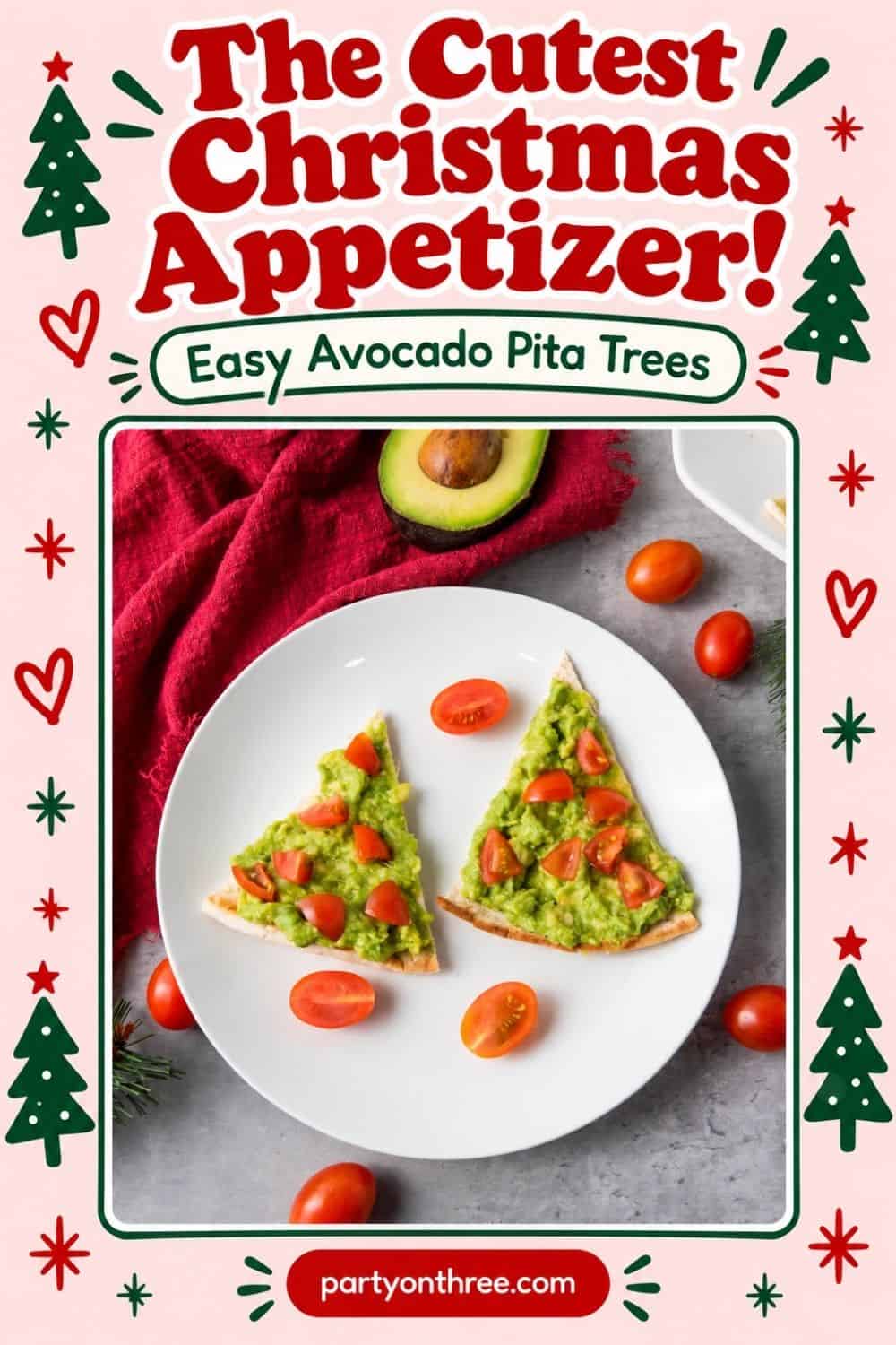 Christmas appetizer of triangle pita tree slices topped with mashed avocado and diced tomatoes on a white plate