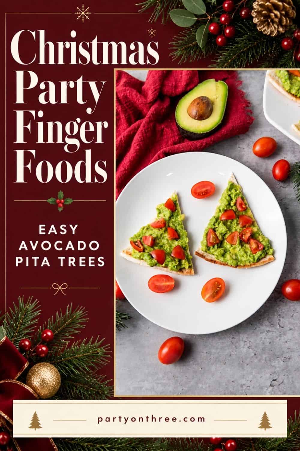 Christmas appetizer plate of avocado pita tree triangles topped with cherry tomatoes, beside a halved avocado