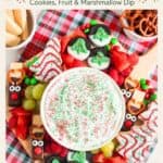 Christmas charcuterie board with marshmallow dip, reindeer pretzel treats, Oreos, fruit, and cookies
