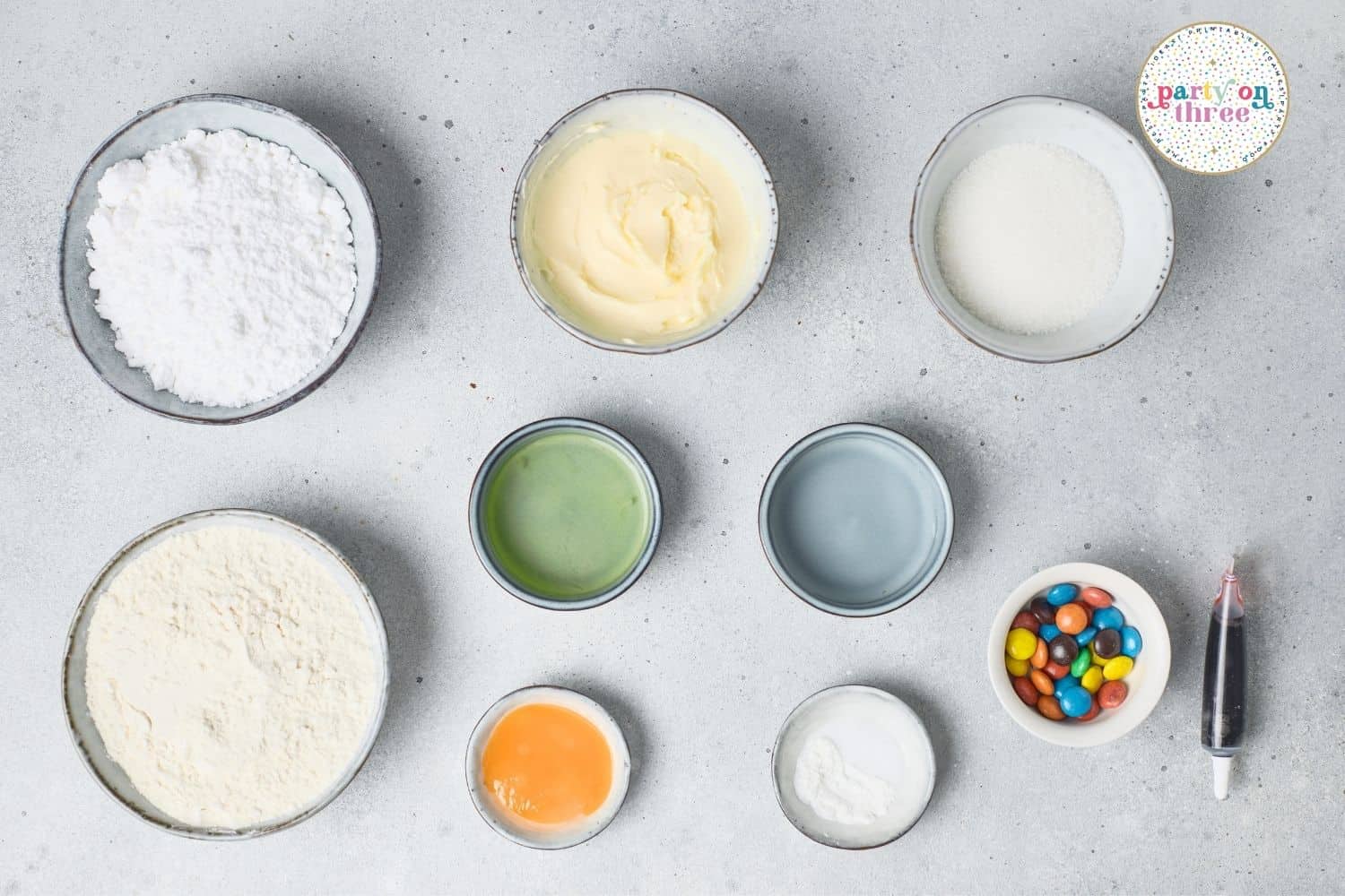 Ingredients for Christmas Light Cookies: powdered sugar, butter, sugar, flour, water, egg white, M&Ms, gel dye