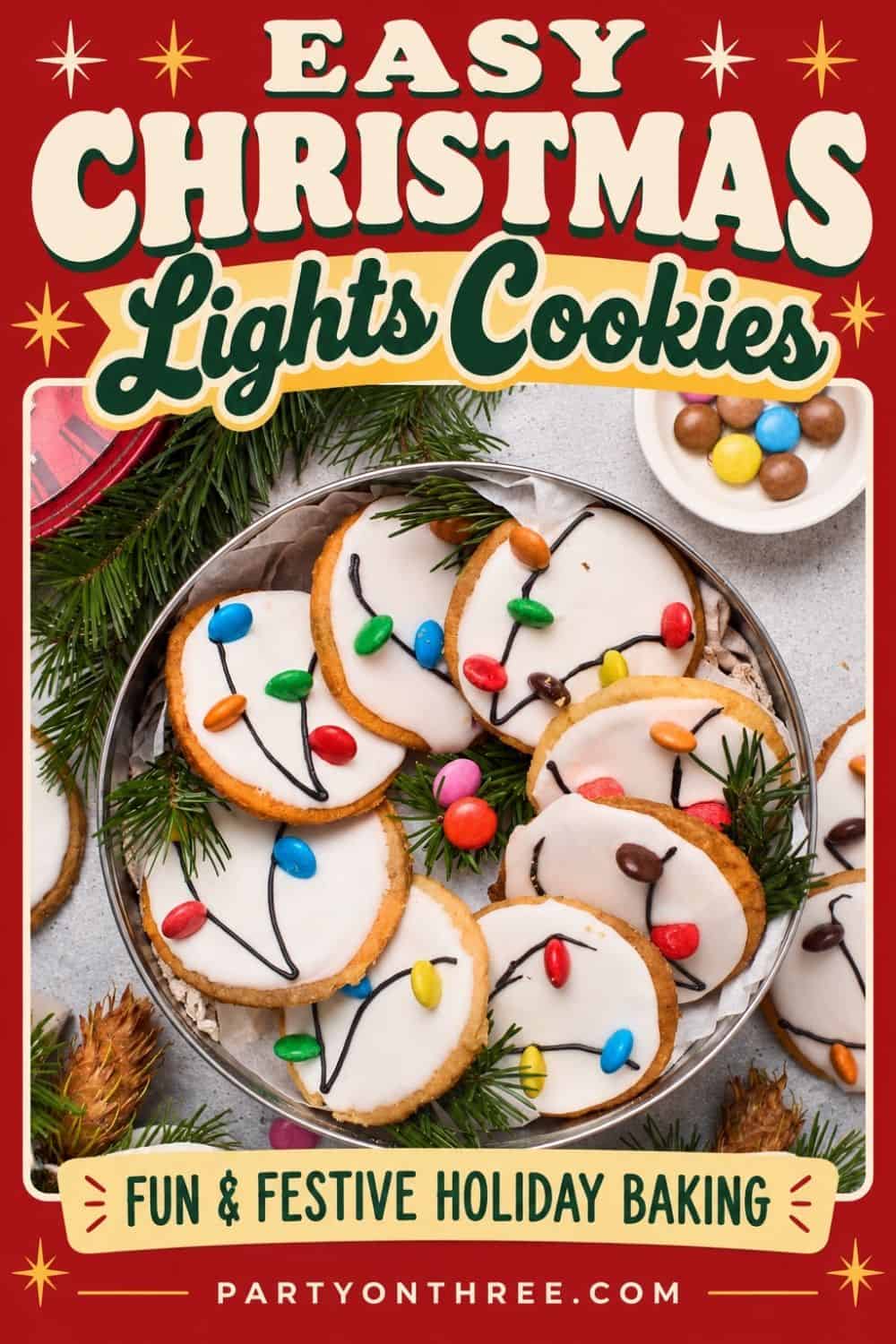 Christmas Light Cookies with white icing and candy lights arranged on a tin, surrounded by pine sprigs.