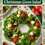 Christmas Wreath Salad shaped on a plate with spinach, mozzarella, tomatoes, pomegranate seeds, and balsamic drizzle.