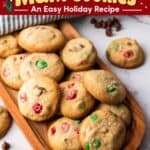 Easy Christmas cookies with red and green M&M candies and chocolate chips piled on a wooden tray