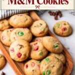 Easy Christmas M&M cookies with red and green candies piled on a wooden tray