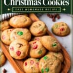 Easy Christmas cookies with red and green M&M's and chocolate chips piled on a wooden serving board