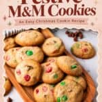 Easy Christmas cookies with red and green M&M's piled on a wooden tray beside chocolate chips