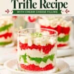 Mini Christmas trifle cups layered with red and green cake, cream cheese filling, and whipped cream on top