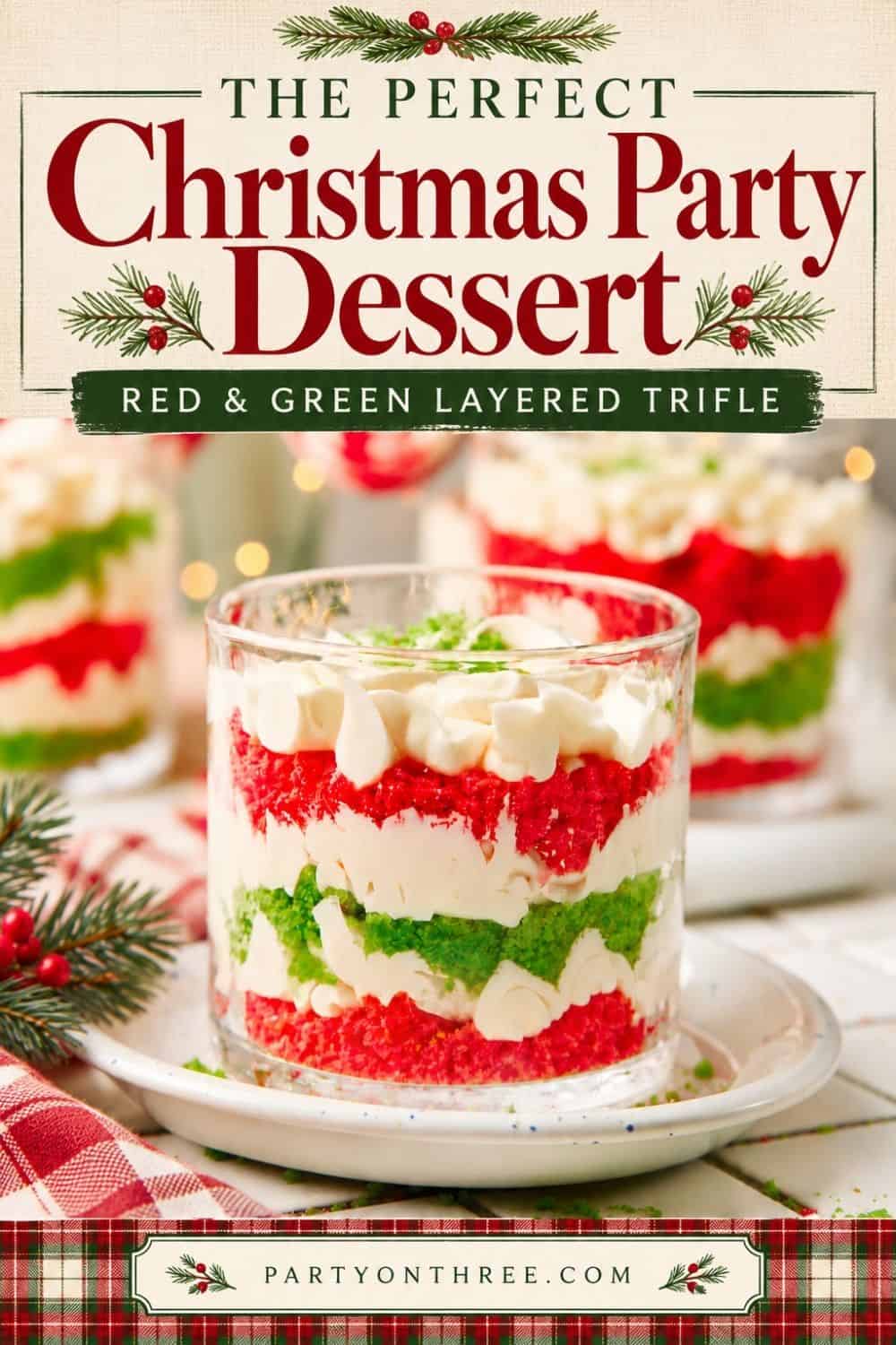 Mini Christmas Trifle Cups with layered red and green cake, whipped cream, and berries in glasses