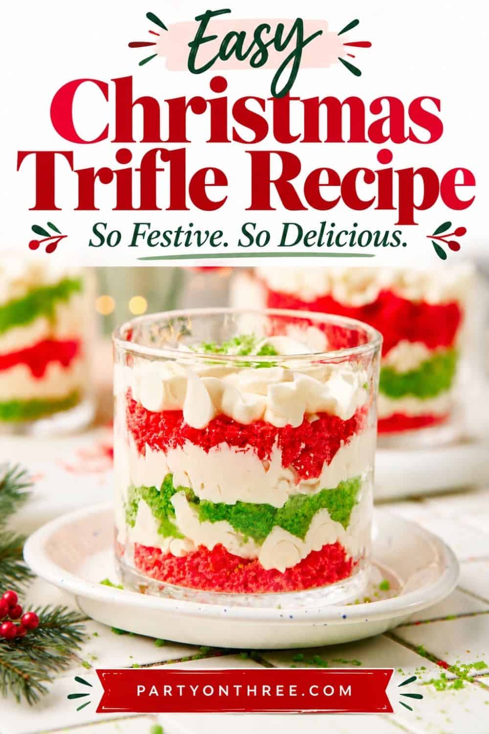 Mini Christmas Trifle Cups layered with red and green cake crumbs and whipped cream in glass cups