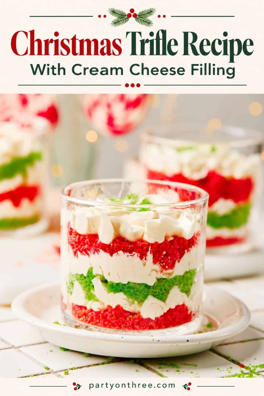 Mini Christmas Trifle Cups with layered red and green cake, cream cheese filling, and whipped topping