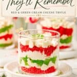 Mini Christmas Trifle Cups with layered red and green cake, cream cheese filling, and whipped topping