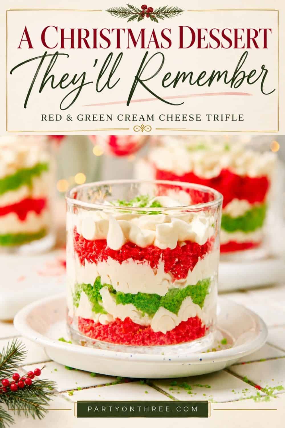 Mini Christmas Trifle Cups with layered red and green cake, cream cheese filling, and whipped topping
