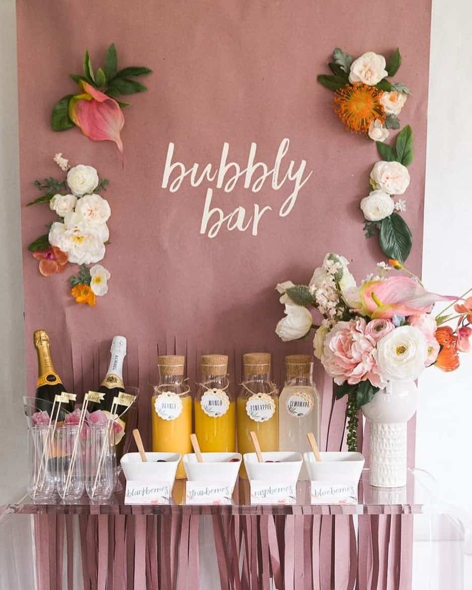 Pink Bubbly Bar With a Floral Backdrop Sign