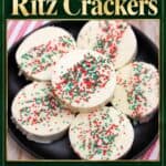 White chocolate-covered Ritz Cracker Christmas Cookies with red and green sprinkles on a black plate
