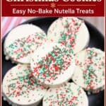 Ritz Cracker Christmas Cookies coated in white chocolate and topped with red and green sprinkles on a black plate