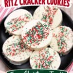 White chocolate-dipped Ritz Cracker Christmas Cookies topped with red, green, and white sprinkles on a black plate