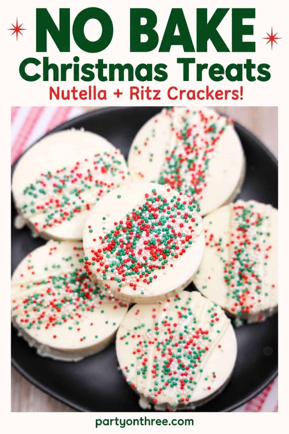 White chocolate-dipped Ritz Cracker Christmas Cookies topped with red, green and white sprinkles on a black plate.
