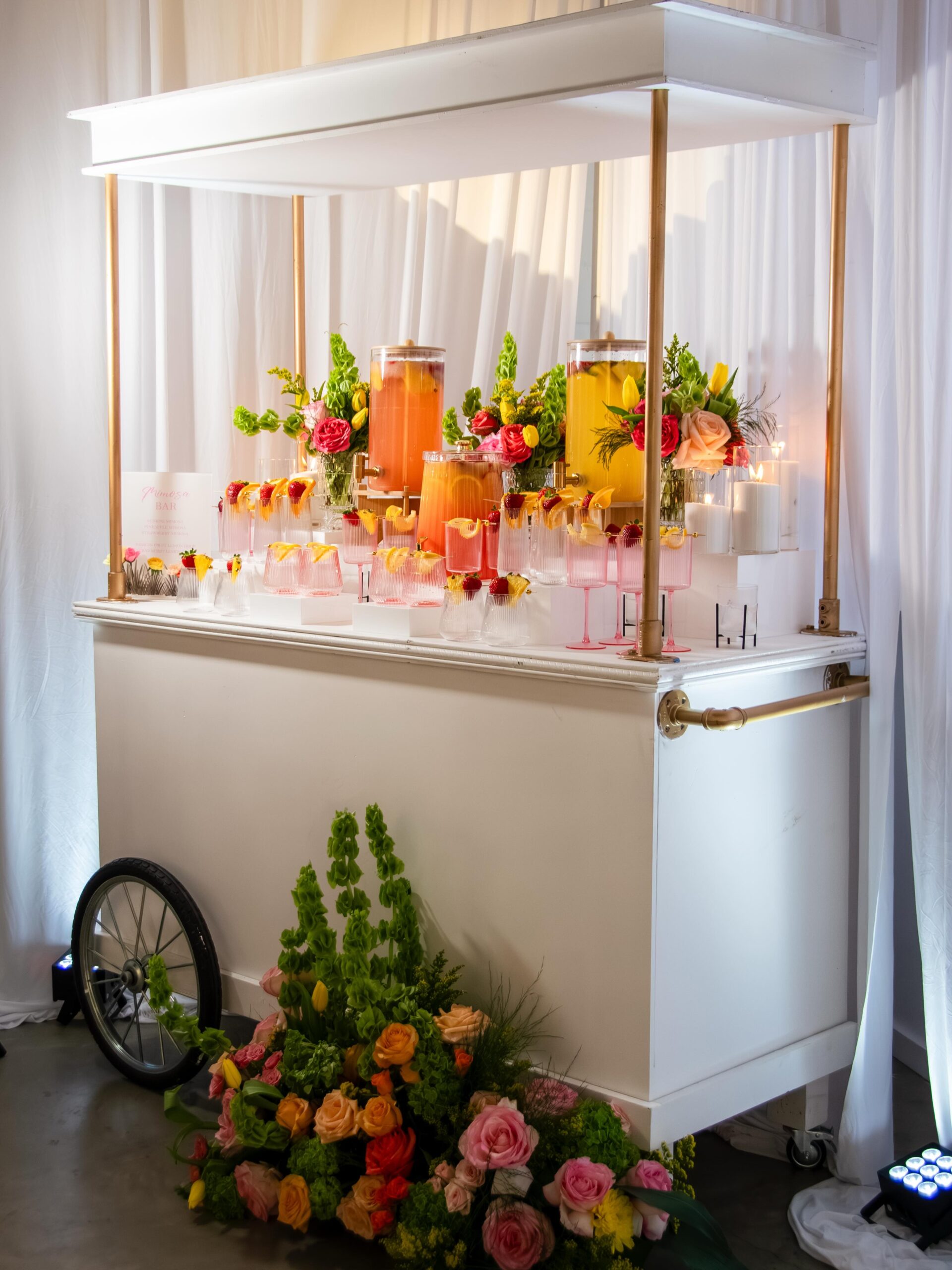 Rolling Cart Mimosa Bar With Pink Champagne Flutes